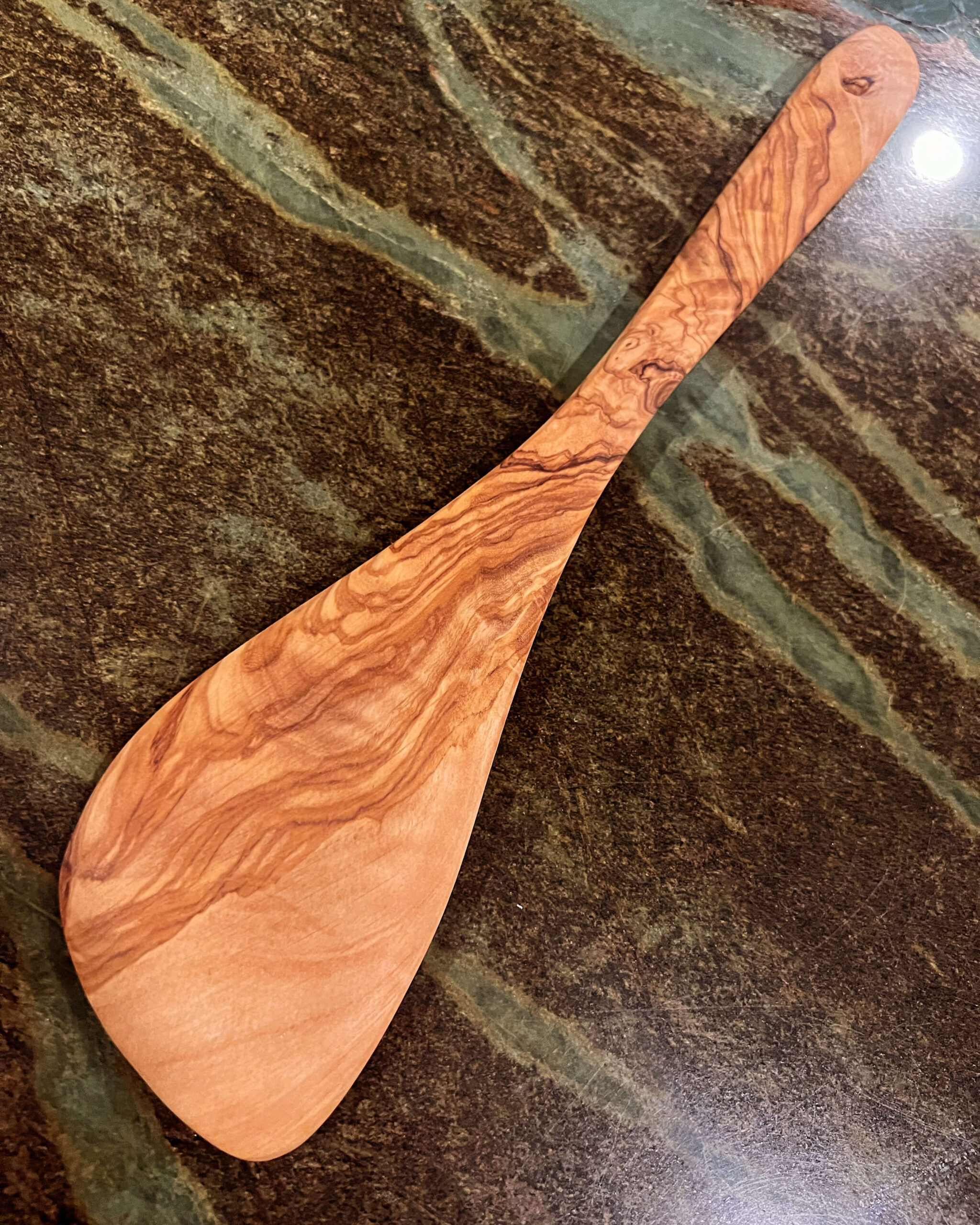 Wooden spoon made out of olive wood.