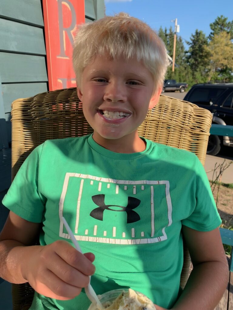Child enjoying ice cream in the city of Nevis, MN.